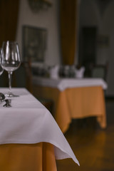 Interior of a classic restaurant in an old castle. Traveling in Europe. Served tables and antiquity.