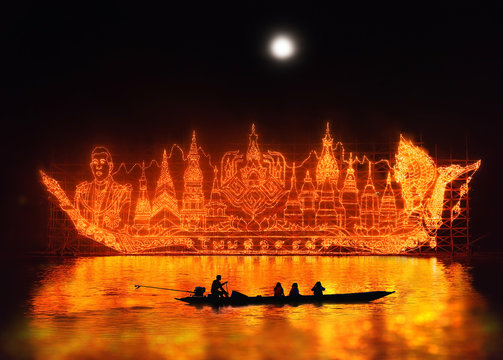 raditional fire boat floating in Mekong river at night with design the light lamp about Phrathat Phanom Pagoda, king of Thailand, Fire-boat festival, Nakhon Phanom province, Thailand.