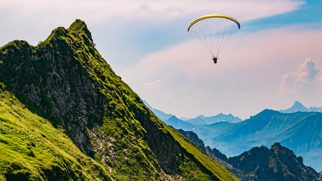 Beautiful alpine view with a paraglider at the H&ouml;fatsblick near the famous Nebelhorn summit Oberstdorf, Bavaria, Germany