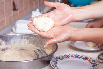 woman hand kneading yeast dough