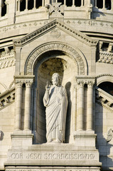 Fototapeta premium The sculpture of Jesus Christ on the exterior of the Basilique du Sacre Coeur de Monmartre in Paris, France