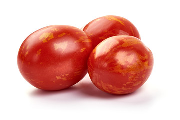 Fresh colorful sweet rustic tomatoes, isolated on white background