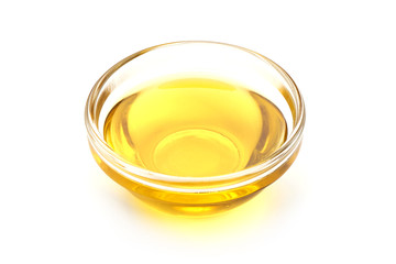 Vegetable oil in a bowl, isolated on white background