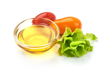 Vegetable oil in a bowl, isolated on white background