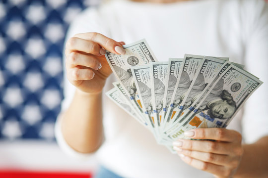 Female hand holding  money. Close-up Hands with American dollars. Business concept
