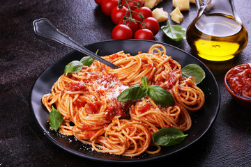 Plate of delicious spaghetti Bolognaise or Bolognese with savory minced beef and tomato sauce garnished with parmesan