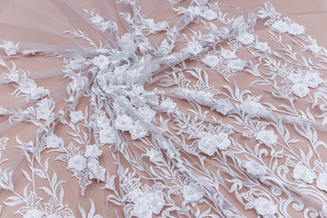 Texture lace fabric. lace on white background studio. thin fabric made of yarn or thread. a...
