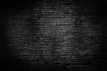 Deurstickers Bakstenen muur Zwarte bakstenen muren die geen gepleisterde achtergrond en textuur zijn. De textuur van de baksteen is zwart. Achtergrond van lege bakstenen keldermuur.