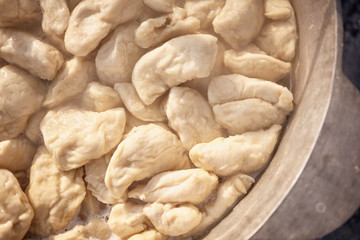 Fresh homemade dumplings in a bowl close up.