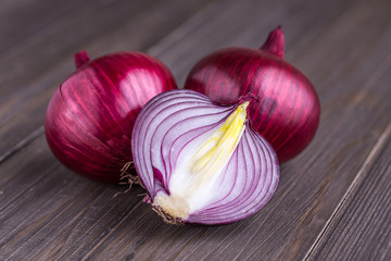 red onions on rustic wood