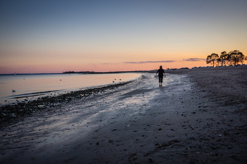 Fototapeta na wymiar Walk on the Beach at Sunset