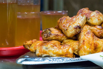 Fried chicken wings on a tray in a fast food restaurant in Russia.