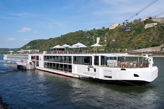 KOBLENZ, GERMANY - September 3, 2016: river cruise ship VIKING VIDAR with Rhine cable car and Fortress Ehrenbreitstein in the background. VIKING VIDAR has a capacity of 190 passengers.