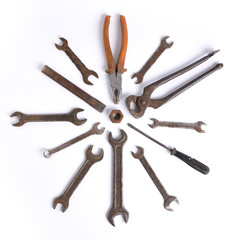 Old rusty stainless steel crescent wrench isolated on white top view