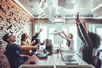 Teamwork business people excited happy smile, throw papers and documents fly in air.