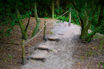 Natural stairs made of stone in a park or garden. Arrangement of nature