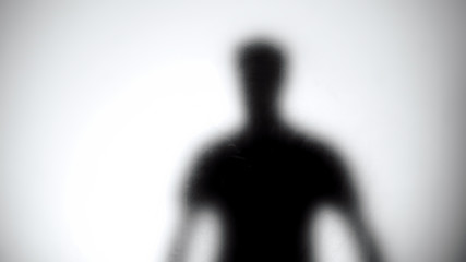 Male silhouette against glass wall, men health statistics template, anonymous