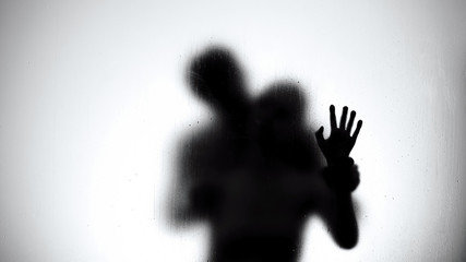 Silhouette of lovers couple hugging and kissing in shower, intimate relationship - 290833809