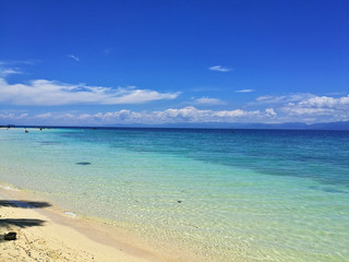 Fototapeta na wymiar White Sand Beach and the turquoise ocean in Moalboal, Cebu, Philippines