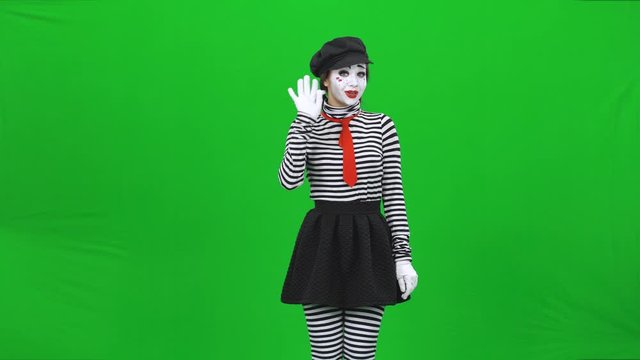 Mime girl is smiling, seducing and calling someone. Chroma key.