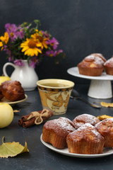 Muffins with apples and nuts on a dark background, vertical orientation, Autumn composition