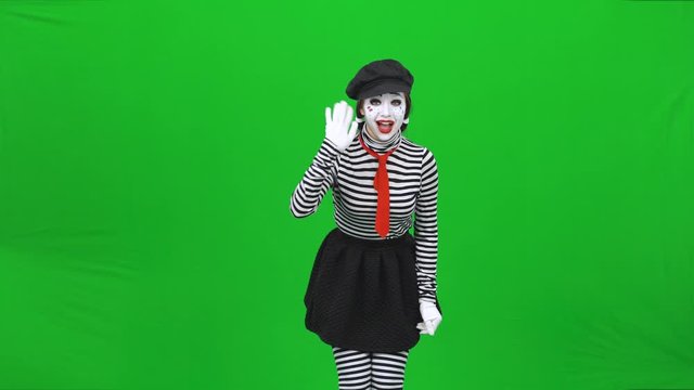 Mime girl is calling someone, smiling and gesticulating. Chroma key.
