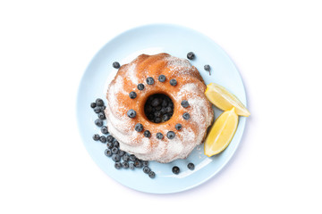 Cake with powdered sugar, blueberry and lemon isolated on white background