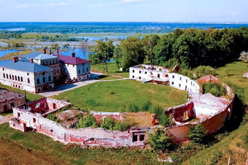 Old ruined house of the 19th century. Old house and stables by the river.