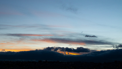 A shape of a volcano on the clouds at sunrise