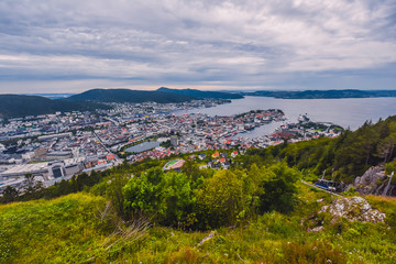 Fototapeta na wymiar Bergen, Norway - july 18 2019: tourist look at the Scandinavian city of Bergen on a summer day