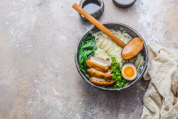 Shio ramen bowl with pork, pak choi and egg, copy space