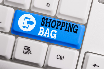 Conceptual hand writing showing Shopping Bag. Concept meaning Containers for carrying demonstratingal possessions or purchases Keyboard with note paper on white background key copy space