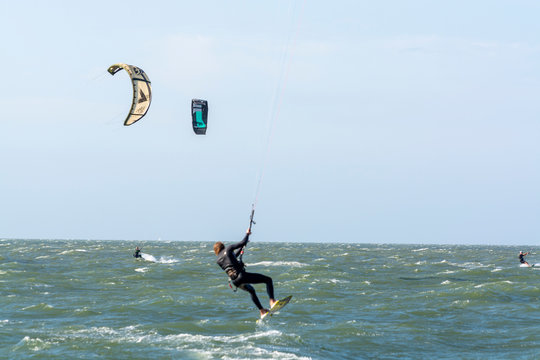 Water sport event, kite surfers race in North Sea near Renesse, Zeeland, Netherlands