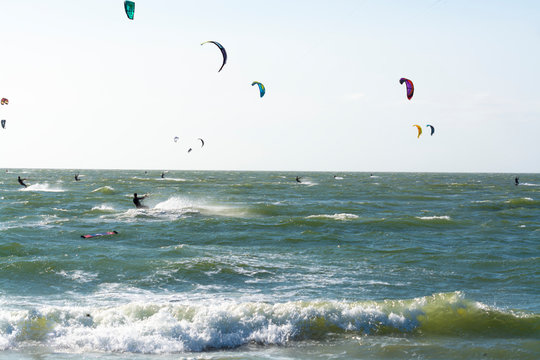 Water sport event, kite surfers race in North Sea near Renesse, Zeeland, Netherlands