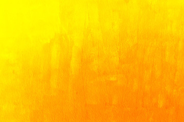 Yellow painted wall. Textured wall surface. Bright background.