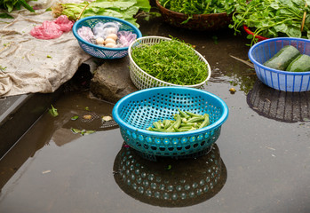 Baskets of food on ground, Hoi An Market, Vietnam