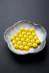 Vitamin C tablets. Black background. Close up. Copy space.  