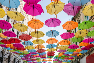 Fototapeta na wymiar Colorful umbrellas as street decoration in Timisoara, Romania