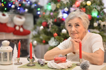 Portrait of cute senior woman preparing for Christmas
