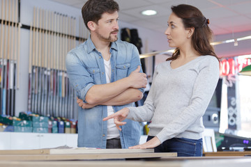pool seller talking to female customer