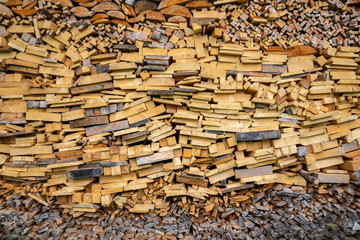 Pile of wooden pieces used for firewood. The stack creates an interesting pattern.