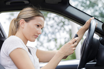 female driver texting while driving