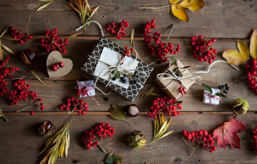 Autumn composition with dry leaves gifts and berries