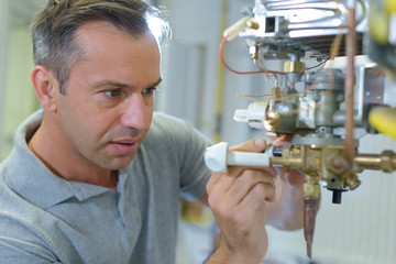 a technician repairing electric boiler