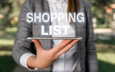 Word writing text Shopping List. Business photo showcasing Discipline approach to shopping Basic Items to Buy Outdoor scene with business woman holds lap top with touch screen