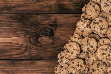 Chock chip cookie on wooden table with copy space. Top view. Flat lay