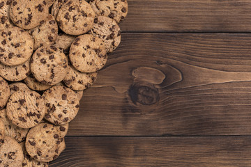 Chock chip cookie on wooden table with copy space. Top view. Flat lay