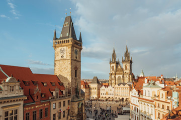 Fototapeta na wymiar Prague, Czech Republic - March, 18th, 2019: View of the Old Town Square in Prague from the terrace of a house, with tourists and locals, walking and shopping.