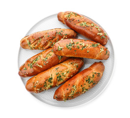 Plate of bread loaves with garlic and herbs on white background, top view