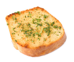 Slice of bread with garlic and herbs on white background